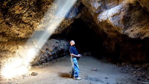 Erstwhile Hawaii resident checking out lava tube in Mojave National Preserve