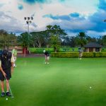 People golfing in Hawaii